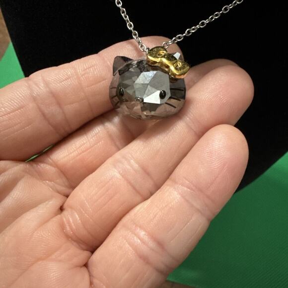 SWAROVSKI SANRIO HELLO KITTY CRYSTAL FACE JET GOLD RIBBON NECKLACE - Picture 6 of 13